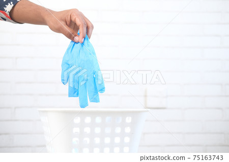 dispose the medical face mask and gloves in a bin,  75163743
