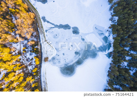 Aerial view of frozen lake from above Aerial view of frozen lake from above 75164421
