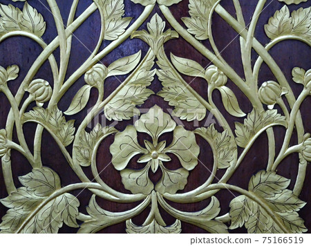 CYBERJAYA, MALAYSIA -JULY 04, 2017: Wood carving with floral motif. The carving was wrapped with gold leaves.  75166519