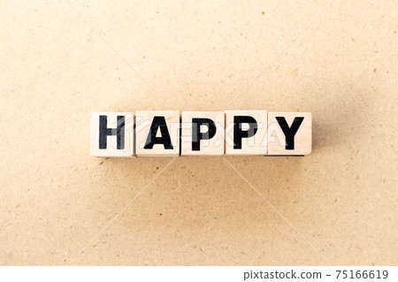 fetter block in word happy on wood background fetter block in word happy on wood background 75166619
