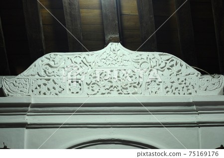 JOGJAKARTA, INDONESIA -JUNE 12, 2014: Stone work design and detail at Old Masjid Besar Mataram Kotagede, Jogjakarta Indonesia. According to history, the mosque was build on 1575. JOGJAKARTA, INDONESIA -JUNE 12, 2014: Stone work design and detail at Old Masjid Besar Mataram Kotagede, Jogjakarta Indonesia. According to history, the mosque was build on 1575. 75169176