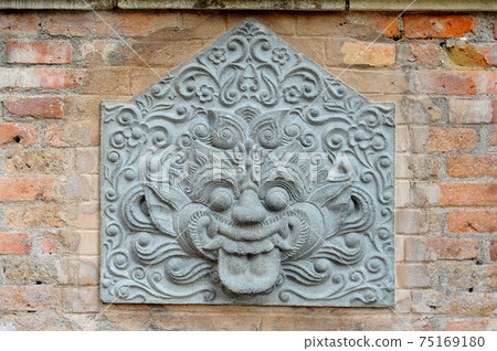 JOGJAKARTA, INDONESIA -JUNE 12, 2014: Stone work design and detail at Old Masjid Besar Mataram Kotagede, Jogjakarta Indonesia. According to history, the mosque was build on 1575. JOGJAKARTA, INDONESIA -JUNE 12, 2014: Stone work design and detail at Old Masjid Besar Mataram Kotagede, Jogjakarta Indonesia. According to history, the mosque was build on 1575. 75169180