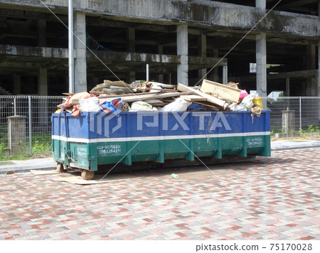 SELANGOR, MALAYSIA -JANUARY 15, 2017: Construction wasted disposal bin used to collect rubbish and unused material at the construction site. SELANGOR, MALAYSIA -JANUARY 15, 2017: Construction wasted disposal bin used to collect rubbish and unused material at the construction site. 75170028