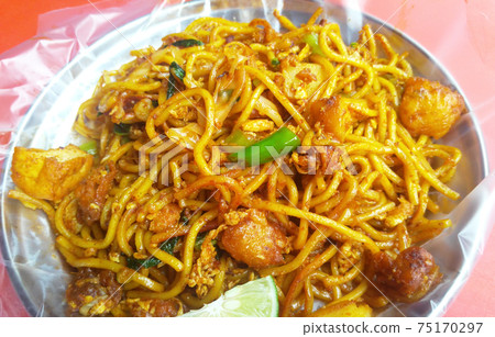 SELANGOR, MALAYSIA -JANUARY 15, 2017: Malaysian style fried noodle or local tongue call mee goreng SELANGOR, MALAYSIA -JANUARY 15, 2017: Malaysian style fried noodle or local tongue call mee goreng 75170297