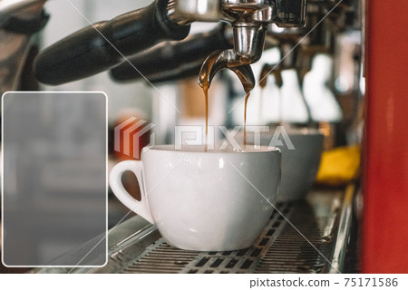 old coffee machine, there are two white glasses on it old coffee machine, there are two white glasses on it 75171586
