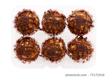 Cake anthill on a white background. Anthill cake in a plastic container from a supermarket. 75172838