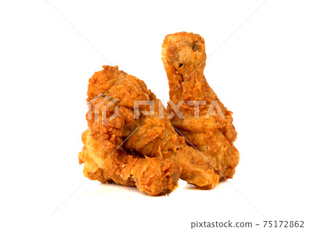 Fried legs on a white background. Chicken legs deep fried close-up. Fried legs on a white background. Chicken legs deep fried close-up. 75172862