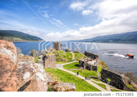 Ruins of Urquhart Castle with famous lake Loch Ness in Scotland 75173305