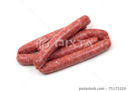 Raw sausages on a white background. Grilled sausages close-up on a white background. 75173320