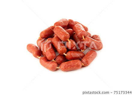 Small smoked sausages on a white background. Grilled sausages close-up on a white background. 75173344
