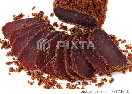 Jerky on a white background. Close-up of basturma sliced into pieces. 75173608