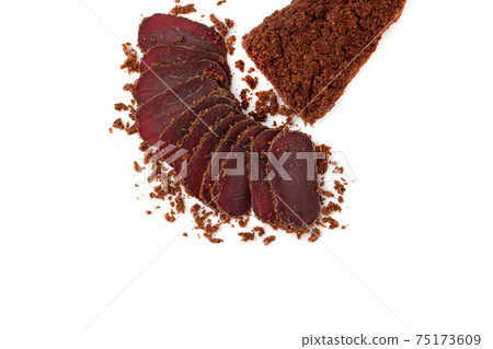 Jerky on a white background. Close-up of basturma sliced into pieces. 75173609