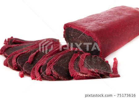 Jerky on a white background. Close-up of basturma sliced into pieces. Jerky on a white background. Close-up of basturma sliced into pieces. 75173616