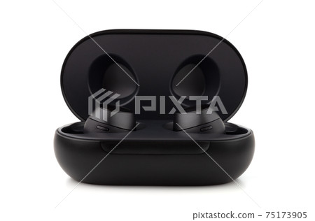 Wireless headphones on a white background. Headset close up in the charging case close-up. 75173905