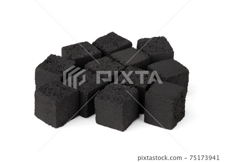 Coconut charcoal on a white background. Coconut coal cubes for hookah close-up. Coconut charcoal on a white background. Coconut coal cubes for hookah close-up. 75173941