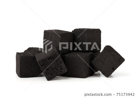 Coconut charcoal on a white background. Coconut coal cubes for hookah close-up. Coconut charcoal on a white background. Coconut coal cubes for hookah close-up. 75173942