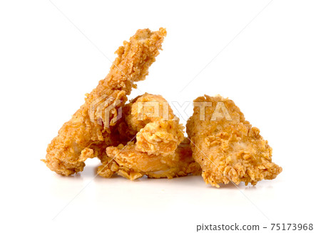 Fried chicken fillets on a white background. Fried chicken nuggets close-up. Fried chicken fillets on a white background. Fried chicken nuggets close-up. 75173968