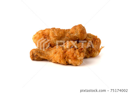 Fried legs on a white background. Chicken legs deep fried close-up.. Fried legs on a white background. Chicken legs deep fried close-up.. 75174002