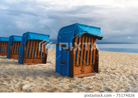 Beach landscape with deck chairs at Baltic Sea on Ruegen Island, Germany Beach landscape with deck chairs at Baltic Sea on Ruegen Island, Germany 75174026