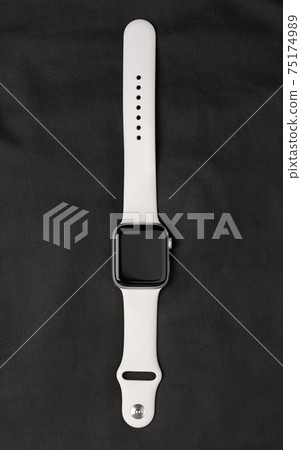 Smart Watch on a black leather surface. 75174989