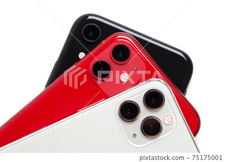Three smartphones close-up on a white background. 75175001