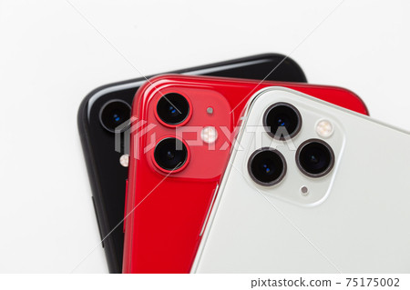 Three smartphones close-up on a white background. 75175002