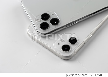 Two smartphones close-up on a white background. 75175009
