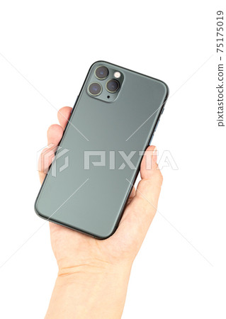 Smartphone with three cameras in hand on a white background. Smartphone with three cameras in hand on a white background. 75175019