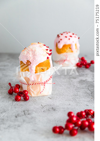 Traditional Easter cake, decorated with sugar decor icing, berries, flowers on grey background. Happy Easter Holidays, copy space. 75175219