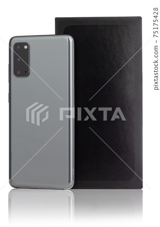 Smartphone on a white background. Smartphone and box from it isolated on a white background. 75175428
