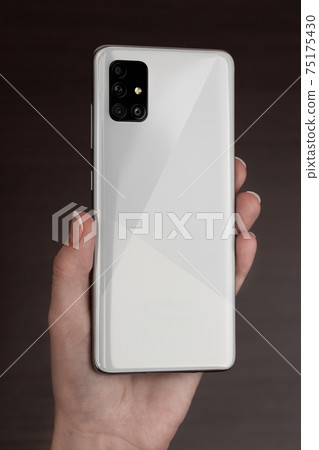 Smartphone With Three Cameras In Hand. Smartphone With Three Cameras In Hand. 75175430