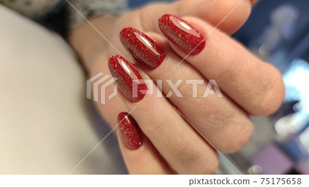 Closeup photo of a beautiful female hands with elegant manicure Closeup photo of a beautiful female hands with elegant manicure 75175658