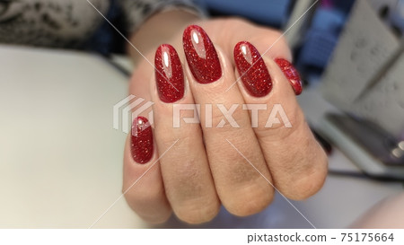 Closeup photo of a beautiful female hands with elegant manicure Closeup photo of a beautiful female hands with elegant manicure 75175664