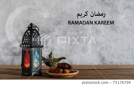 Other mean Ramadan Kareem. holiday background. Arabic lantern metal on brown wooden and Aladdin lamp or Arabic lantern. Halal meal set for fasting is obligatory for Muslim. Moon and star icon. 75176794