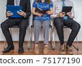 Group of people waiting for interview in a waiting room. 75177190