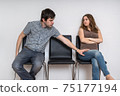 Young man is touching woman in waiting room. Sexual harassment c 75177194