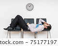 Tired bored man is sleeping in waiting room on chairs. 75177197