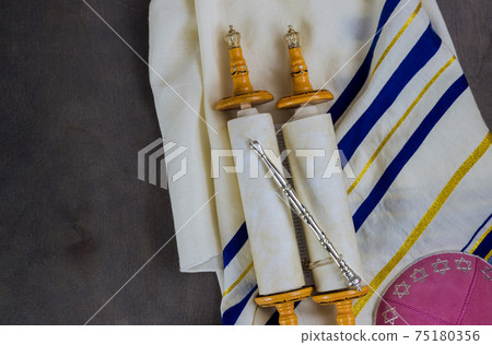 Jewish holidays, during prayer items kippa with prayer shawl tallit on shofar, torah scroll Jewish holidays, during prayer items kippa with prayer shawl tallit on shofar, torah scroll 75180356