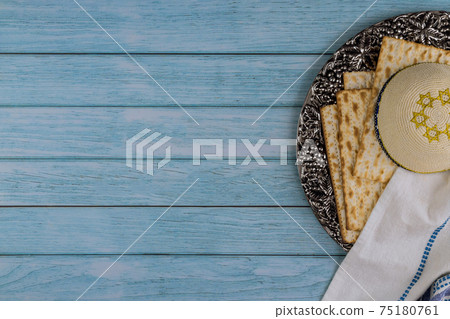 Passover celebrating Jewish family holiday symbols of great traditional kosher matzah Passover celebrating Jewish family holiday symbols of great traditional kosher matzah 75180761