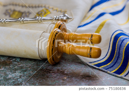 Prayer book with torah scroll and prayer shawl tallit jewish religious symbols 75180836