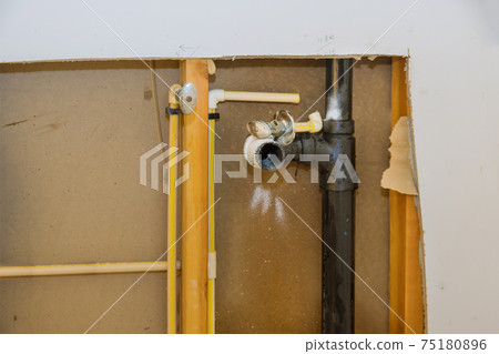 Plumbing pipe in the repair service, repairing leaking damaged wall 75180896