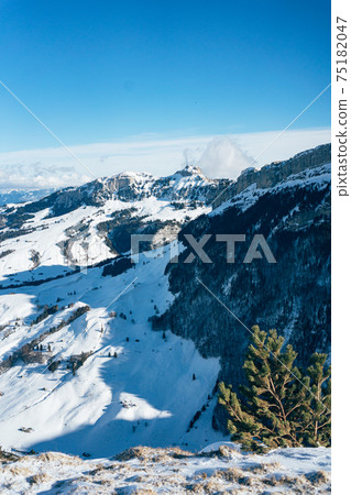 beautiful sunny snowy mountain landscape on Ebenalp in Appenzell 75182047