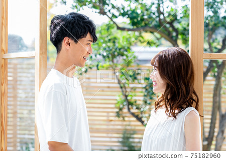 Young couple staring at each other Young couple staring at each other 75182960