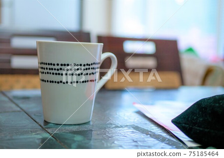 White cup placed on the table White cup placed on the table 75185464