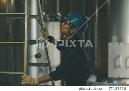 Boiler engineer in the printing factory boiler room Boiler engineer in the printing factory boiler room 75185816