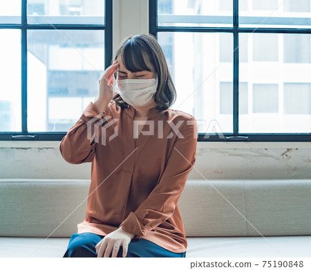 Women's headache in mask Women's headache in mask 75190848