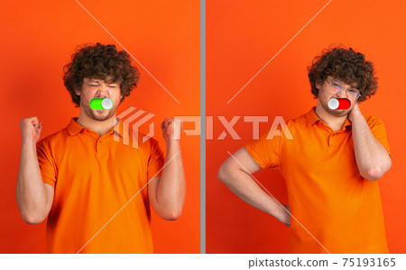 Mood switch on male face. Happy and angry, splitting personality. Modern interface and human emotions Mood switch on male face. Happy and angry, splitting personality. Modern interface and human emotions 75193165