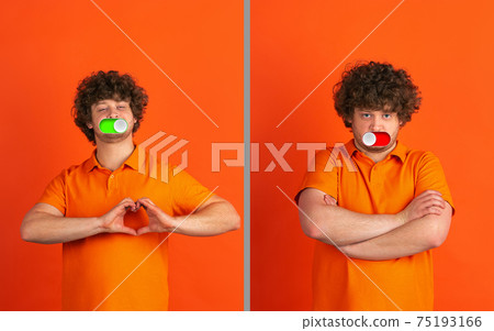 Mood switch on male face. Happy and angry, splitting personality. Modern interface and human emotions Mood switch on male face. Happy and angry, splitting personality. Modern interface and human emotions 75193166