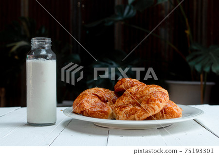 croissant on wooden ground croissant on wooden ground 75193301
