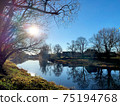 Rural landscape with a river and old wooden houses. 75194768